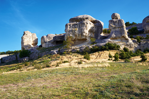 Sunny rocky mountain scene, grass, blue sky, Crimea