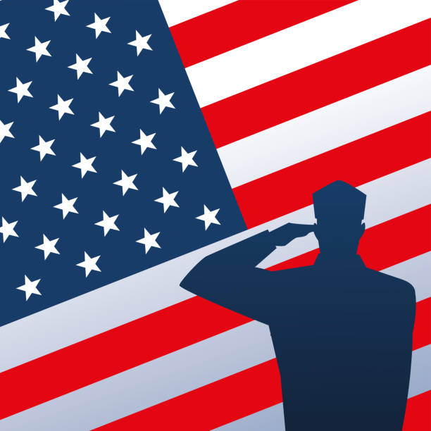 istock happy veterans day, soldier saluting on american flag 1284128360