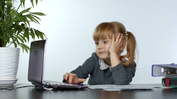 istock Online learning, distance education, lesson at home. Girl doing school program online on computer 1284129418