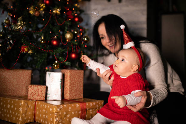 istock Mom and baby celebrating xmas 1284129749