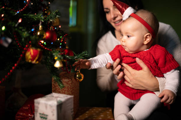 istock Mom and baby celebrating xmas 1284130644