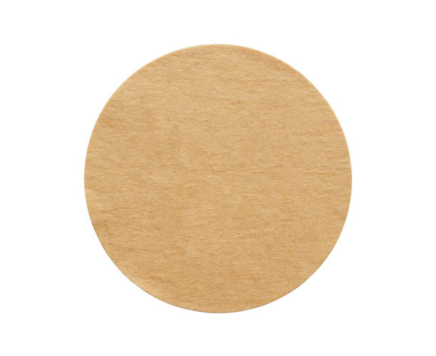 istock Brown round paper sticker label isolated on white background 1284134042