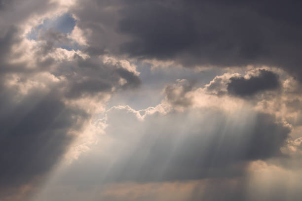 istock The sun's rays passing through the clouds and shining. 1284134338