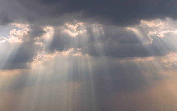 istock The sun's rays passing through the clouds and shining. 1284134345