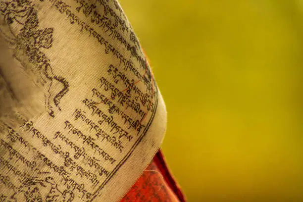 Photo of Portion of a prayer tibetan flag with copy space