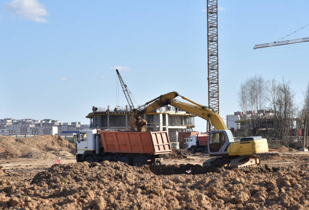 istock Excavator on earthworks at construction site 1284136379