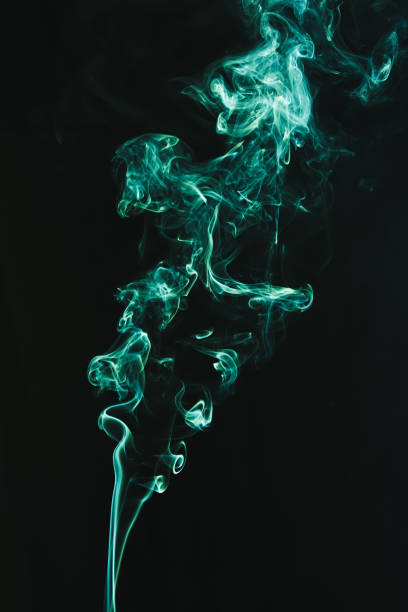 istock Red abstract shaped smoke against black background. Abstract background 1284136991