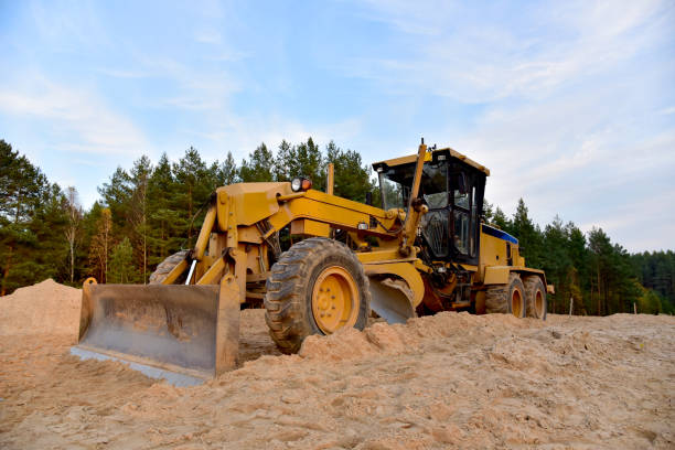 istock Motor Grader on road construction in forest area 1284137044