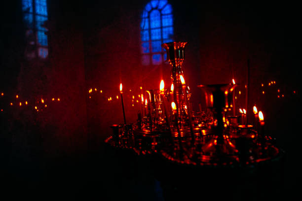 istock Gloom and candlelight inside the church 1284137694