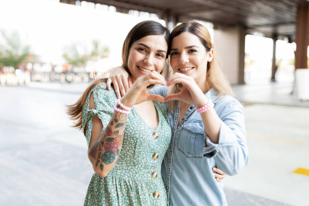 istock Couple with their hands together making a heart 1284137819