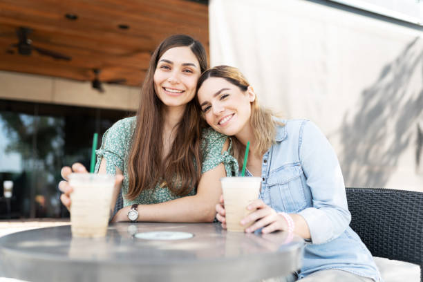 istock Two young friends hanging out in a coffee shop 1284137877