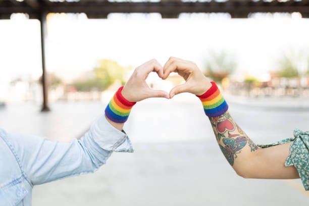 istock Two women's hand forming a heart 1284137931