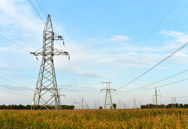 istock High voltage power lines on blue sky background 1284139555