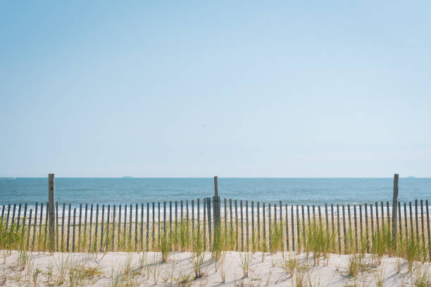 istock Sand dunes at Rockaway Beach, in Queens, New York 1284139937