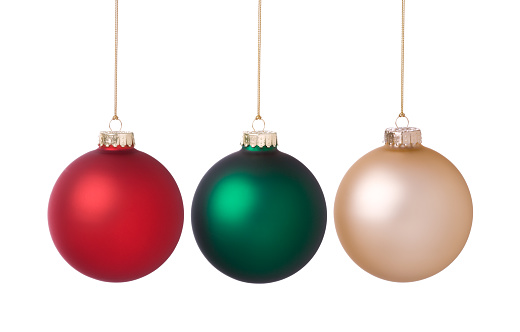 Christmas baubles in red, green and gold isolated on white