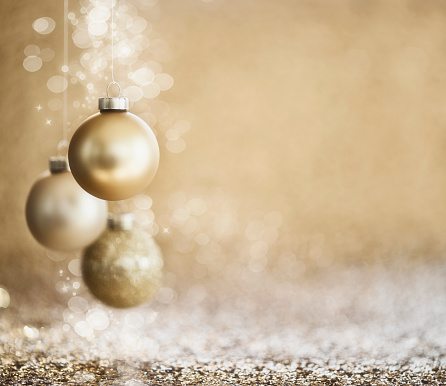 Christmas Gold Baubles on Gold Defocused Background. Very Shallow Depth.