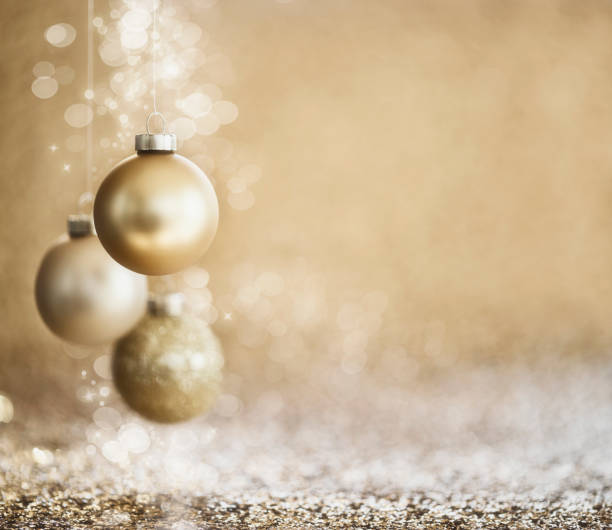 christmas gold baubles on a gold defocused background - ribbon curled up hanging christmas imagens e fotografias de stock