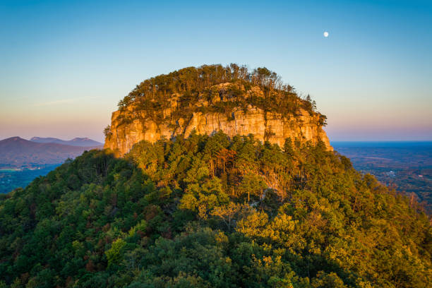 The Big Pinnacle of Pilot Mountain, seen at sunset from Little Pinnacle Overlook at Pilot Mountain State Park, North Carolina stock photo
