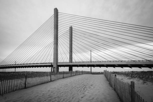 The Indian River Bridge and sandy path near Bethany Beach, Delaware