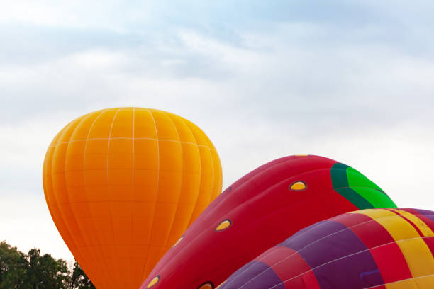 istock three balloons against cloudy skies 1284146391