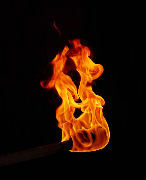 istock Torch flame in the darkness 1284147153