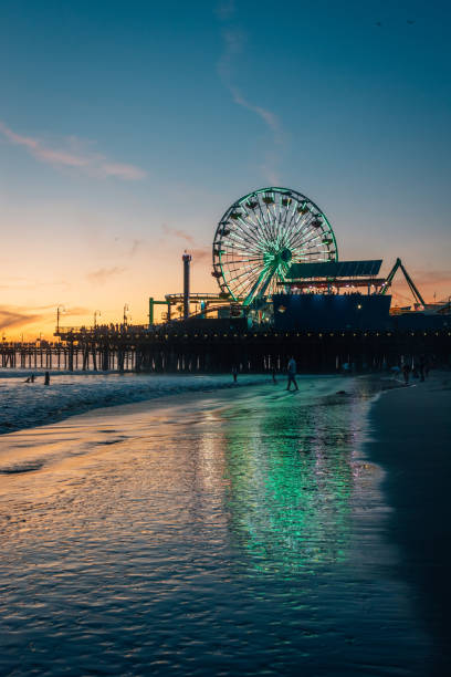The Santa Monica pier at sunset, in Los Angeles, California stock photo