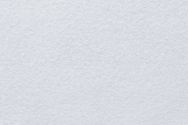 istock Surface of fabric texture in white winter color. 1284147940