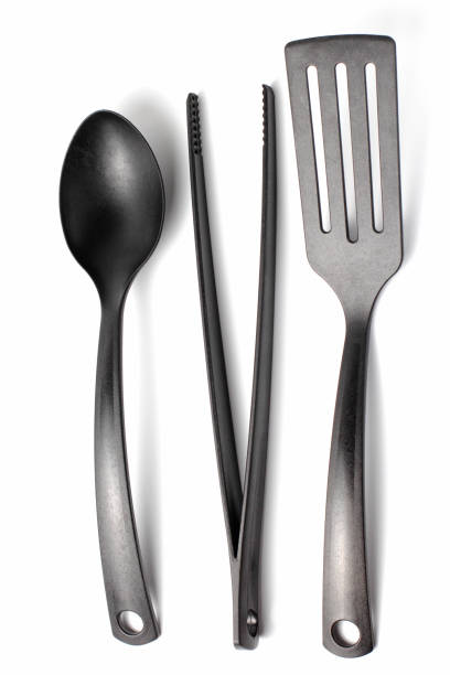 istock Home cooking utensil, spatula, spoon, cooking tweezers, white background, close-up, isolate. 1284150073