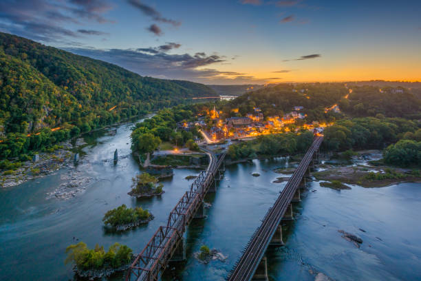 View of Harpers Ferry, West Virginia at sunset from Maryland Heights View of Harpers Ferry, West Virginia at sunset from Maryland Heights harpers ferry photos stock pictures, royalty-free photos & images