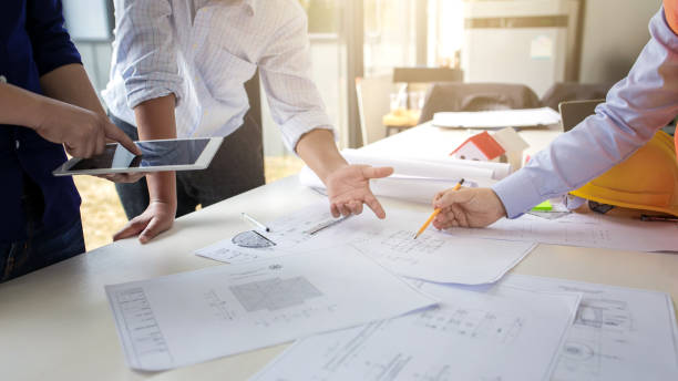 istock Group of engineers working together to plan the project at the meeting. 1284153045