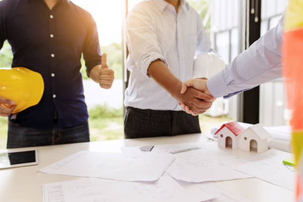 istock Engineers handshake at meeting. Congratulations and agreed to do the project together. 1284153068