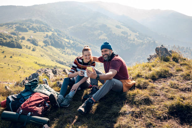 istock Young couple taking a selfie while out camping 1284154839
