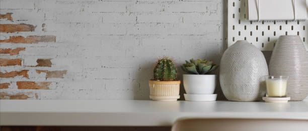 istock Worktable with copy space, plant pot and decorations in home office room 1284156150