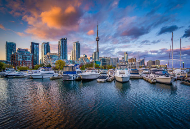 Marina and the downtown skyline at sunset, at the Harbourfront in Toronto, Ontario stock photo