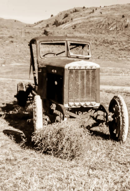 istock Antique Vehicle Abandoned in Field 1284158805