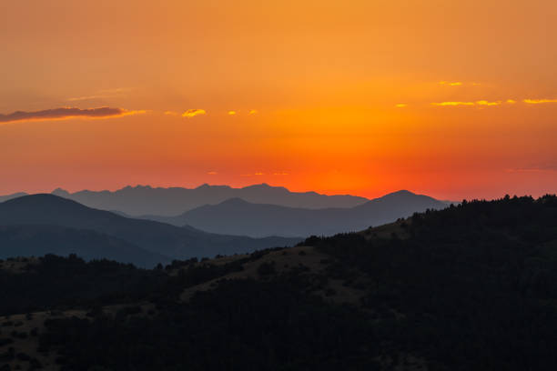 山陰の夕日 - mountain sunset heaven flower ストックフォトと画像