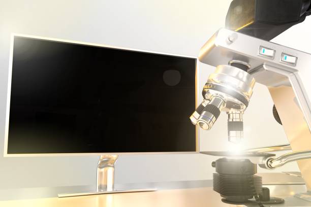 istock microbiology work concept, lab electronic microscope and monitor with blank space for your content with flare on gradient background - object 3D illustration 1284161510