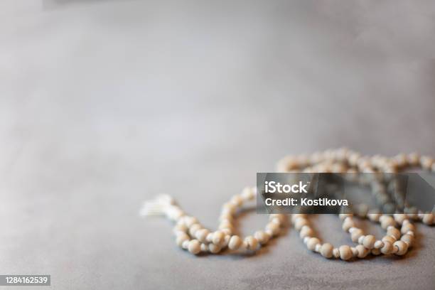 Top View White Rosary Beads Isolated On The Grey Background Stock Photo - Download Image Now