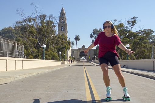 Woman roller skating in San Diego's Balboa Park