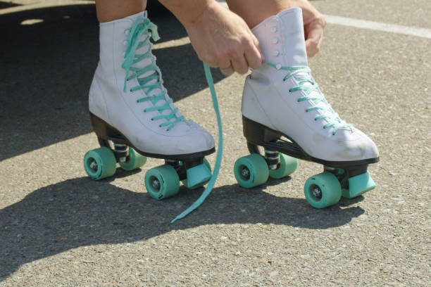 Rollerskating Woman rollerskating in San Diego teal photos stock pictures, royalty-free photos & images