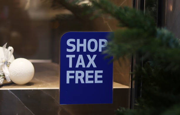 the inscription shop tax free in a shop window at New Year's time the inscription shop tax free in a shop window at New Year's time duty free stock pictures, royalty-free photos & images