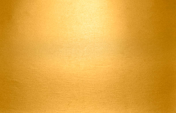 istock Gold textured background. Luxury shiny shimmering gold texture metal sheet 1284174603