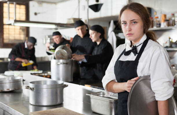 istock Tired and upset waitress in kitchen of restaurant 1284175560