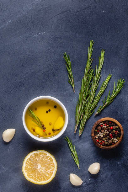 istock Herbs and condiments on black stone background 1284176024