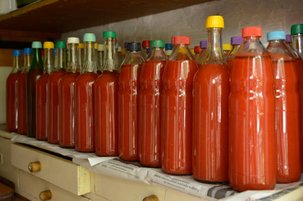 istock tomato juice in glass bottles close up 1284178198