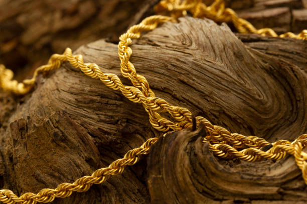 istock gold chain necklace on the tree 1284179889