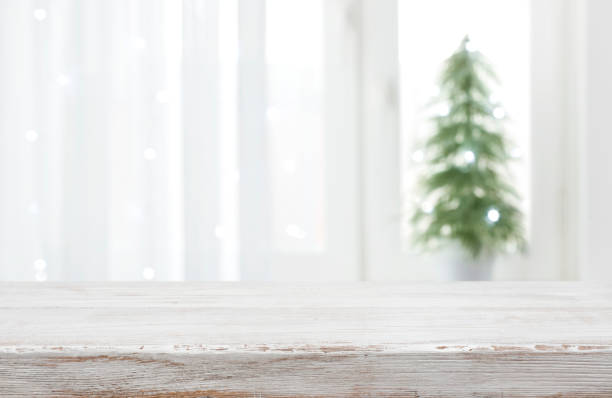 istock Empty vintage wood table in front of blurred holiday background 1284180175