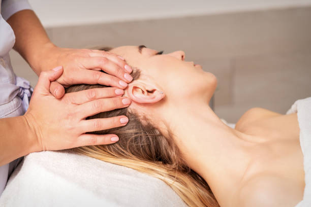 istock Young woman receiving head massage 1284181849