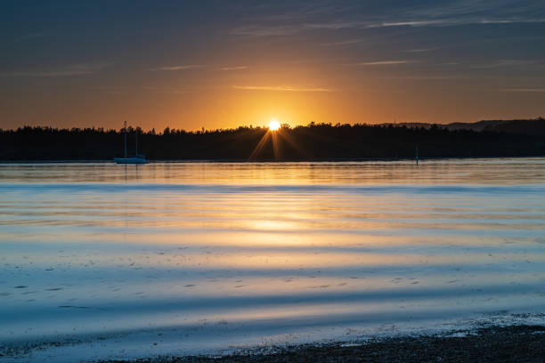 istock High cloud sunrise waterscape over the bay 1284185918