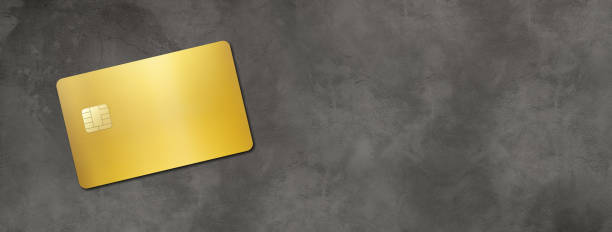 istock Gold credit card on a concrete background 1284186367